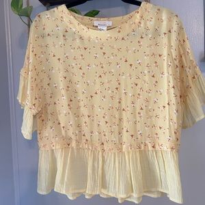 Yellow blouse with floral detail and flowy bottom and sleeves